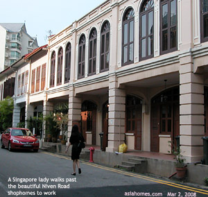 Singapore girl morning walk to office past Niven Road Conservation shophomes. Asiahomes.com 