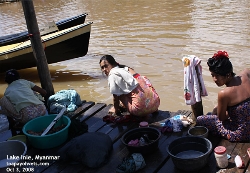 Lake Inle, Myanmar. Rural women wash clothes and hair. Asiahomes.com Travels and Tours
