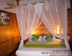 Myanmar, Lake Inle, Myanmar Treasure Resorts spacious bedroom. Asiahomes.com 