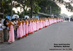 Nuns receiving alms. Myitkyina, Myanmar. Toa Payoh Vets